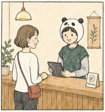 ほのかの受付で来店者を迎える様子